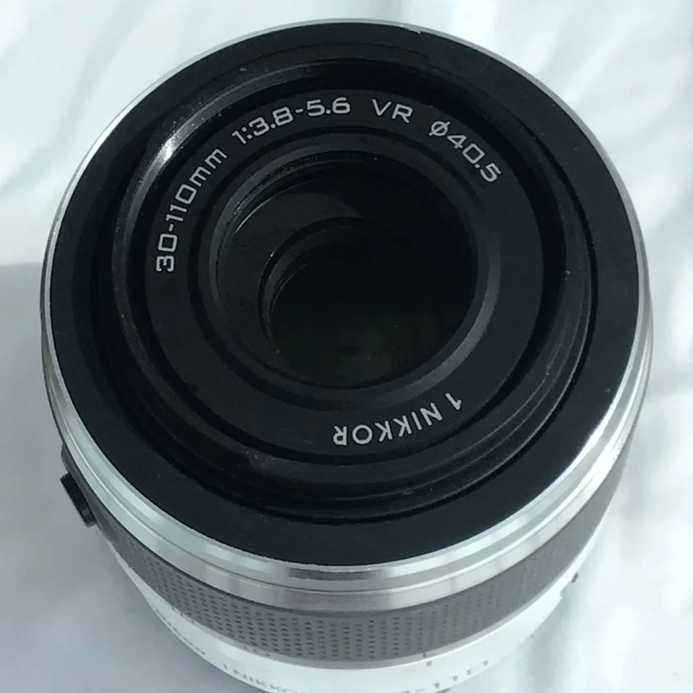 Burgundy Red Nikon 1 J3 high-speed camera with two lenses